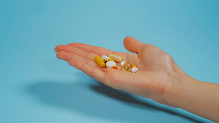Hand holding Various Pills. Overdose or abuse concept. Medicine Drugs Various medicines. Health care and medical treatment concept.