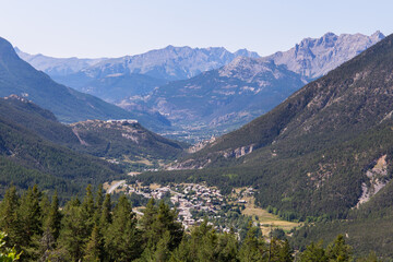 Fototapeta na wymiar View into the mountain valley Val-des-Prés with the city of Briancon.