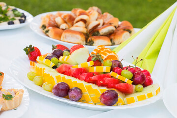 Catering service. Restaurant table with fruit vine oranges, water-melon