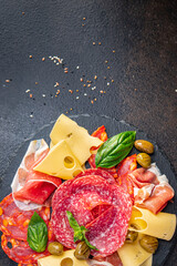 snack plate meat, sausage, cheese, ham, olives fresh portion ready to eat meal appetizer on the table copy space food background rustic. top view