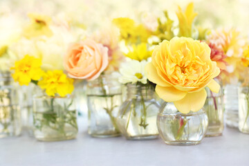 Delicate blossoming yellow rose flowers, blooming festive fall frame background, autumn bouquet floral card, shallow DOF, selective focus, toned