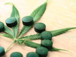 medical pills hemp leaf . cannabis concept. marijuana weed