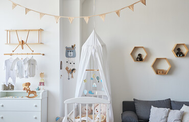 Scandinavian style white interior children's room, bedroom, nursery. Baby cot with ​canopy....