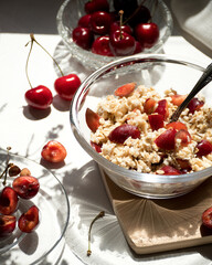 Oatmeal porridge with fresh cherries. Steamed oatmeal on water. Healthy breakfast