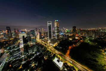 Obraz na płótnie Canvas Aerial view of Architecture details Modern Building Glass facade Business background at night. Jakarta, Indonesia, September 23, 2021