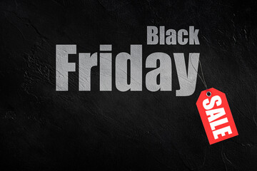 lettering Black Friday with red label Sale on black concrete background