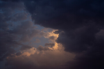 Storm clouds timelapse.Sky during sunset.Sky full of clouds.Cloudy sky.Sunset sky.Dusk.Sun hidden behind the clouds.Clouds and sunset.Dramatic view during sunset