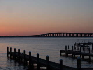 Fototapeta na wymiar Docks and the arched Bay Saint Louis Bridge in Mississippi at Dusk 