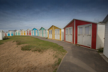 Colorful beach huts in the summer sun