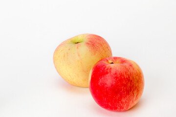 red and yellow apples on a white background