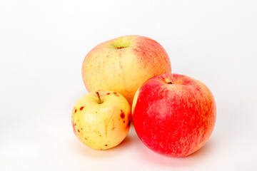 red and yellow apples on a white background