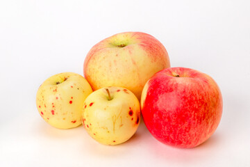 red and yellow apples on a white background