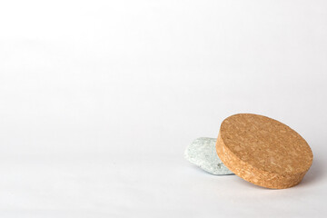 gray stone and cork on a white background