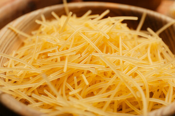 Uncooked vermicelli pasta in bowl