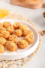 Tray with delicious baklava on table