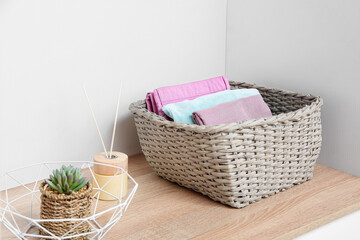 Wardrobe organizer with clothes on shelf in dressing room