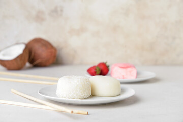 Fototapeta na wymiar Plate with tasty Japanese mochi on table