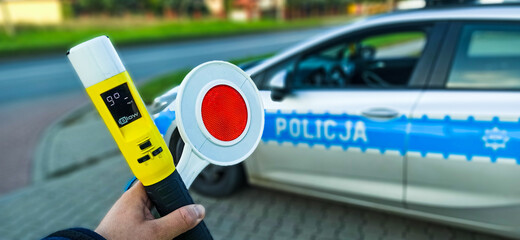 police car and stop sign - obrazy, fototapety, plakaty