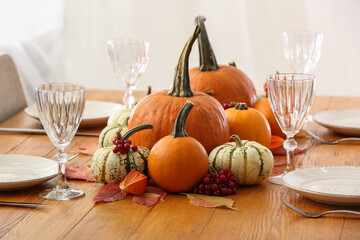 Beautiful autumn decor on served wooden table in room