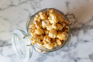 Butterscotch Popcorn in Mason Jar on Marble Kitchen Counter