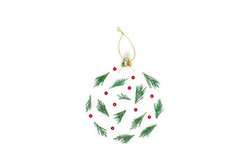 Christmas composition. Stylized Christmas ball made of cypress branches on a white background....