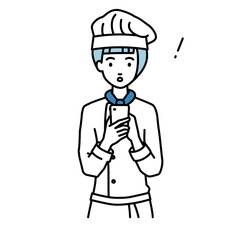 立ってスマートフォンを操作して何かに気づいて驚いた調理師の女性