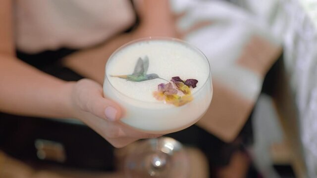 Cocktail with elegant decor in female hands