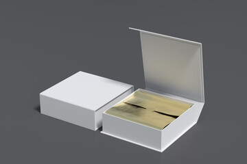 White opened and closed square folding gift box mock up with gold wrapping paper on gray...