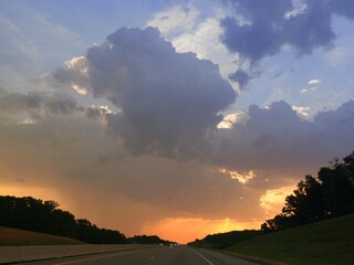 Fototapeta na wymiar Sunrise and beautiful clouds above the highway