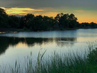 Fototapeta na wymiar Lake reflections of a beautiful sunset