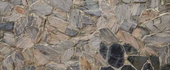 texture of a stone wall. Gray stone wall background. Stone wall as a background or texture. Old castle stone wall texture background.