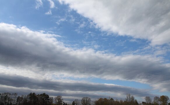 Roll Clouds On A Winter Afternoon With Blue Sky