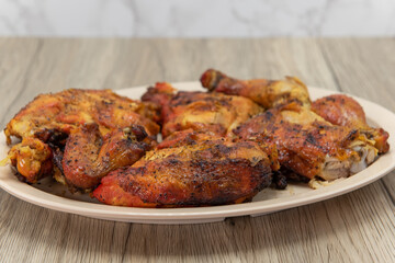 Full chicken roasted to perfection on a plate for a hearty meal