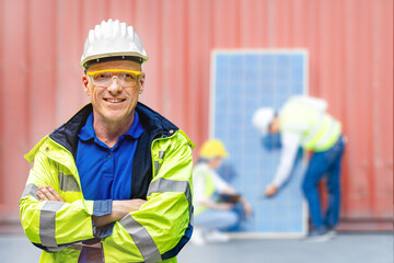 Factory engineer senior man standing confidence with green working suite dress and safety helmet....
