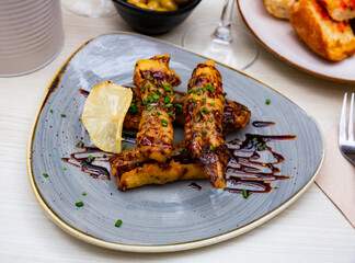 Crispy eggplant tempura with cane honey and chives, vegetarian appetizer