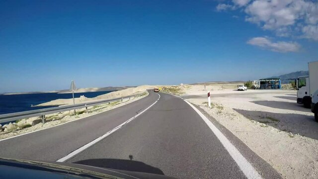 Approaching Pag bridge that connects mainland with island Pag in Croatia, filmed with action camera