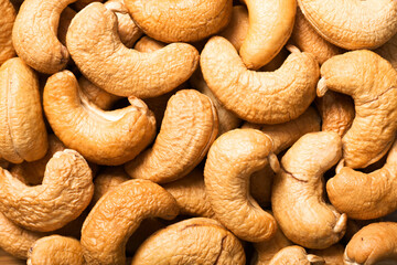 food background of roasted cashew nuts, top view