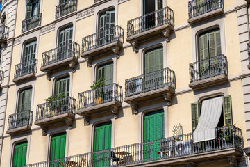 Fototapeta na wymiar Typical house facades of an apartment building in Barcelona, Spain