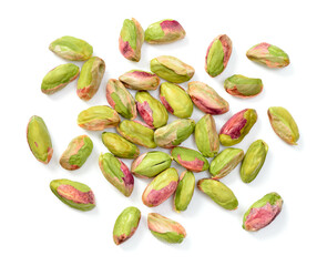 peeled pistachios isolated on the white background, top view