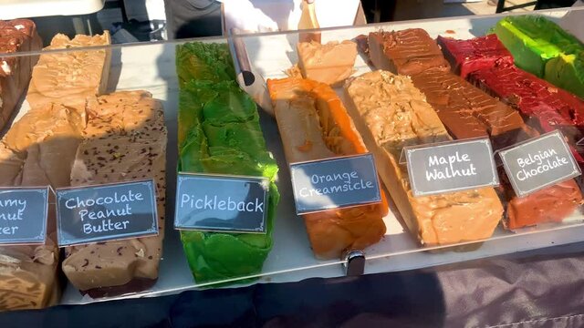 various Fudge flavors sold on stall in Picklesburgh. Picklesburgh is a famous American food festival specifically for pickle lovers.