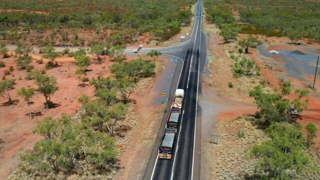 Empty Three-trailer Road Train Driving On The Highway In Queensland, Australia. aerial