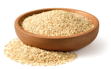 uncooked wheat germ in the wooden bowl, isolated on the white background