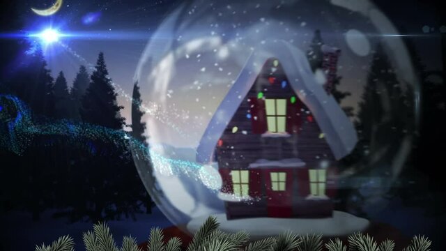 Shooting star around house in a snow globe on winter landscape against moon in the night sky