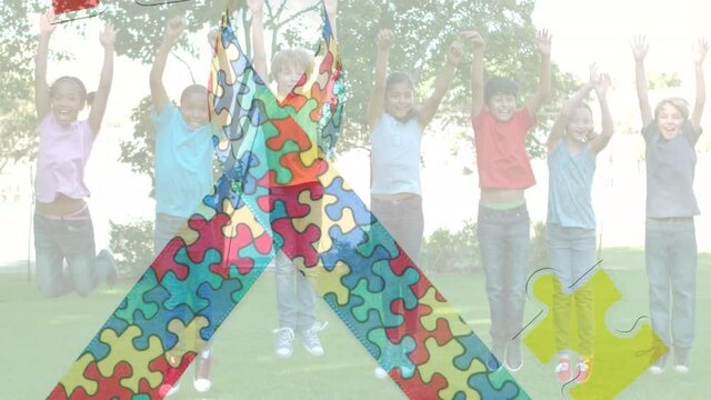 Animation of colourful puzzle pieces creating autism awareness ribbon over schoolchildren