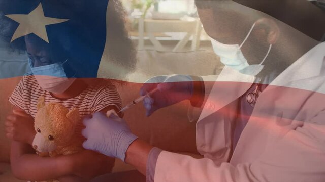 Animation of flag of chile waving over doctor wearing face mask and vaccinating child