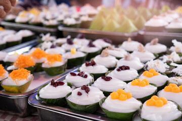 Delicious Thai Dessert wrapped in banana leaves in a local market. Street food