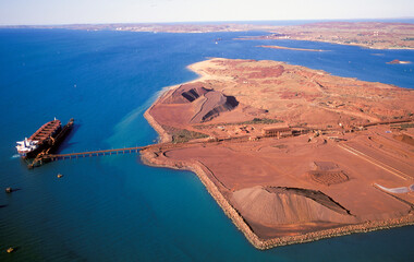 Loading iron ore at Dampier on the Western Australian coast. - 458659222