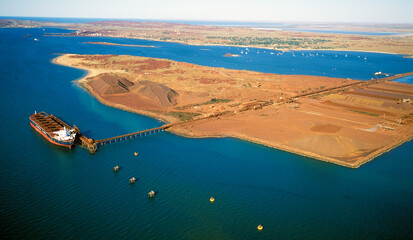 Loading iron ore at Dampier on the Western Australian coast. - 458659232