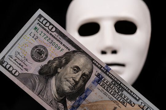 100 american dollar bill and white mask on black background