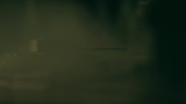 Toy tanks staging battle in ruined city with smoke effects. Macro view of T34 and Panther tanks. Models of famous tanks from WWII: Panther and T34